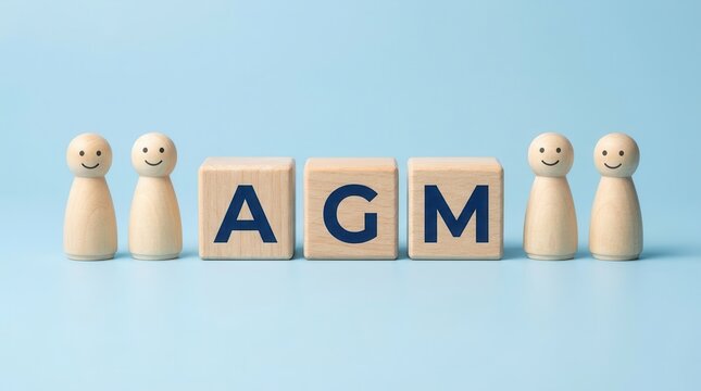 Annual General Meeting AGM concept with wooden people figures and letters.