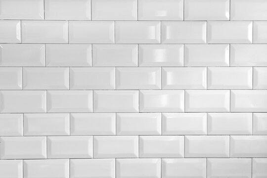 White background with texture of small white tiles &ndash; clean shiny ceramic wall pattern