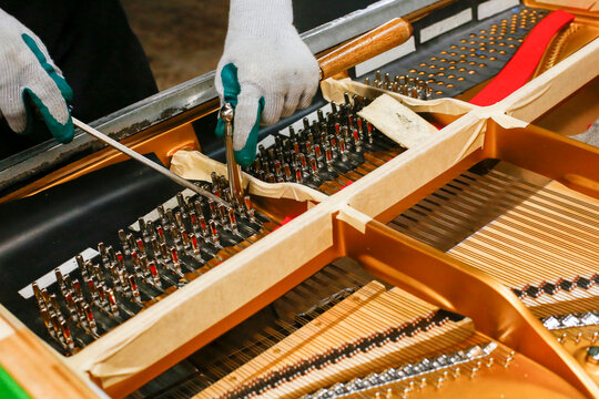 Piano tuning pins with tools during repair