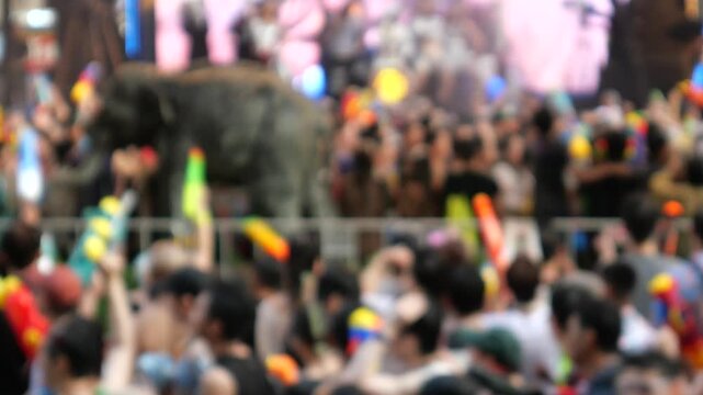
Crowds enjoying Electronic Dance Music during Songkran Festival. Locals and tourists play with water and use water guns to celebrate the Songkran Festival in Bangkok. 