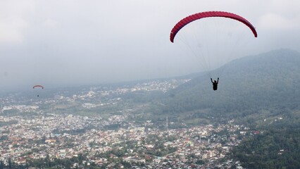 sport, paragliding, sky, extreme, adventure, parachute, activity, fly, air, mountain, freedom, gliding, paraglider, action, travel, flight, nature, landscape, wing, wind, blue, glider, leisure, summer © RentDunk Studio