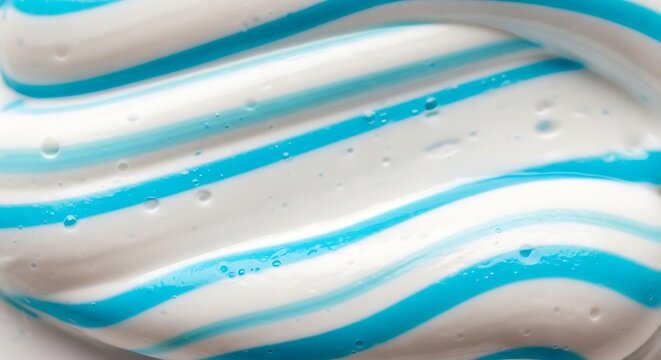 Abstract macro shot of striped blue and white toothpaste texture.