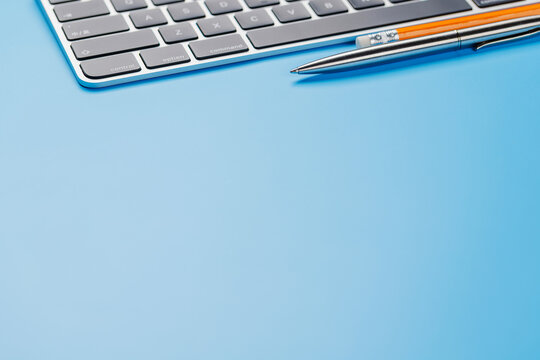 Office supplies on blue desk