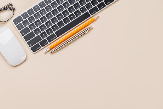 Office supplies on beige desk