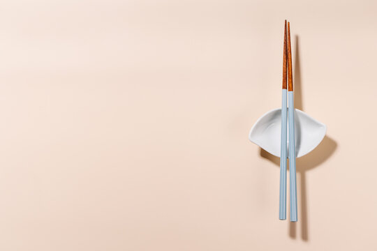 Minimal Chopsticks on Beige Background with Copy Space
