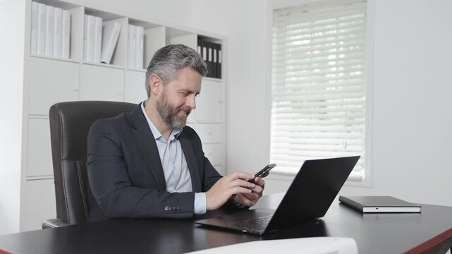 Business man browsing online reports at home office. Businessman typing emails in office. Business man talking about business at workplace. Business man in office.
