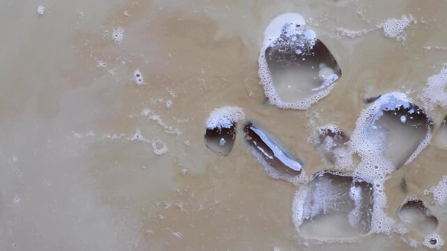 iced coffee with milk and ice cubes texture background