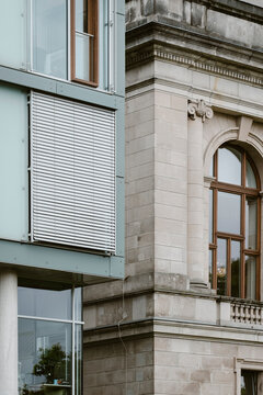 Berlin urban cityscape focuses on heritage stone window facade detail with architecture texture highlighting historic craftsmanship in an building exterior