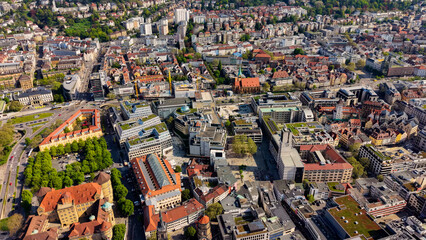 Obraz premium A panoramic aerial view above the old town and downtown in the Stuttgart the capitol city of Baden-Württemberg in Germany on a sunny spring day
