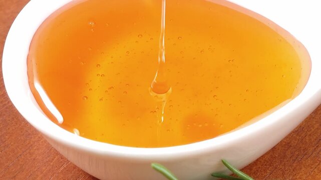 Honey dripping on honeycomb  honey dipper