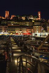 Fototapeta premium Illuminated Cannes old town and marina at night