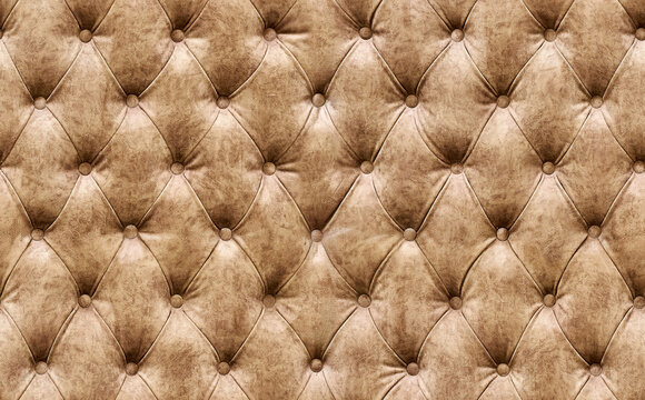 Seamless texture of diamond tufting in a light brown colour suitable for upholstery, furniture, or interior design projects as background