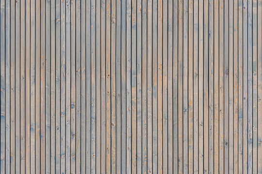 Wainscoting seamless texture made of thin gray-toned pine timber planks provides textured backdrop for design