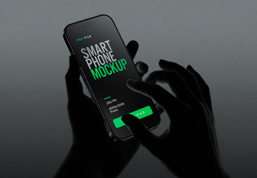 Cinematic Smartphone Mockup Held By Silhouette Hands In Dark Studio