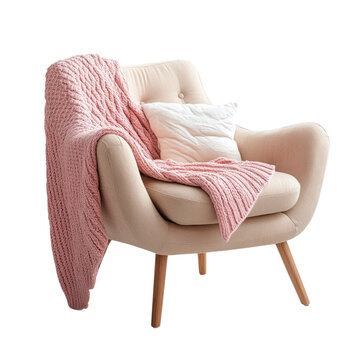 Cozy chair with pink blanket and white cushion placed in a bright room during daytime on transparent