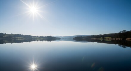 Fototapeta premium serene lake landscape with sun reflection on calm water