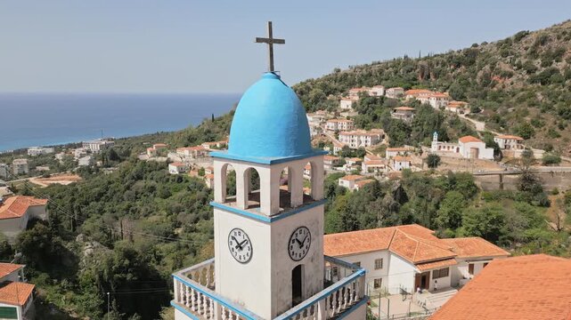 Traditional orange rooftop stone houses and iconic Holy Church of Saint Spyridon