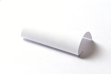 Fototapeta premium Rolled white paper on plain background
