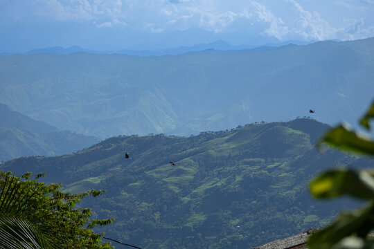 View of Cerro Tusa, the tallest natural pyramid in the world, located in the municipality of Venecia in Colombia, a hill almost 2,000 meters high. And in the view there are also imposing mountains and