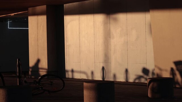 Stockholm, Sweden Shadows of people in the early morning play on a wall in the Slussen district. 