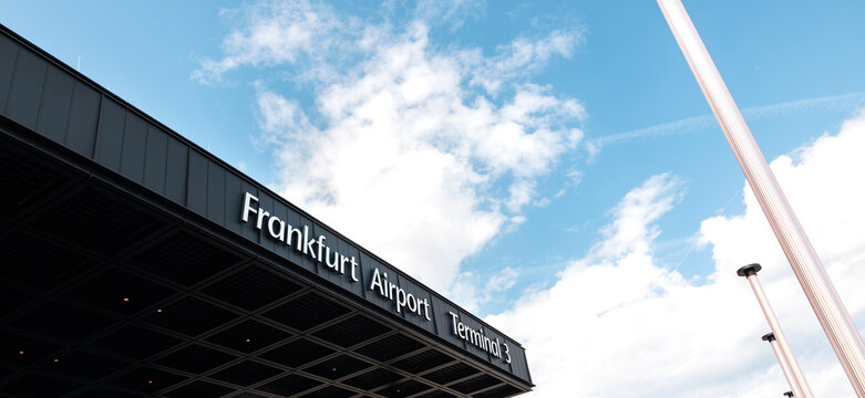 Airport Frankfurt am Main, Germany, April 11, 2026. - Frankfurt International Airport Terminal 3. View to the edge of the building&rsquo;s roof.  Sky with clouds in the background.
