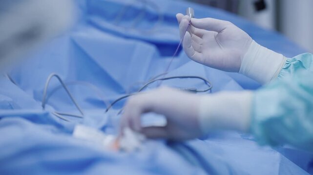 Minimally invasive cardiac catheterization surgery scene with surgical instruments and sterile drapes for medical clinical.