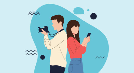 Obraz premium Creative man holding a professional camera and a woman using a smartphone, standing back to back against a blue background.