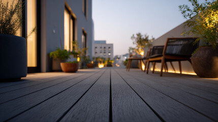 Fototapeta premium Architectural low angle shot of a contemporary rooftop terrace at dusk featuring charcoal composite decking, illuminated planters, and warm interior window reflections.