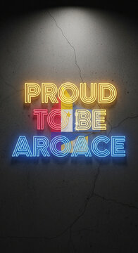 Vertical shot of yellow, red, blue neon letters on cracked gray wall, "Proud to be Aroace" slogan, representative of pride and identity