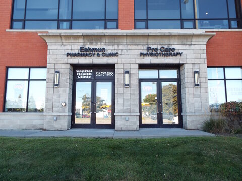 Nepean, Ontario, Canada &ndash; July 28, 2025: The storefront features dual entrances for "Eshmun Pharmacy & Clinic and Pro Care Physiotherapy", with Capital Health Clinic branding prominently displayed at 