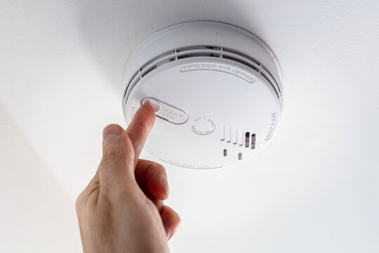 Home smoke and fire alarm detector checking, testing or replace battery