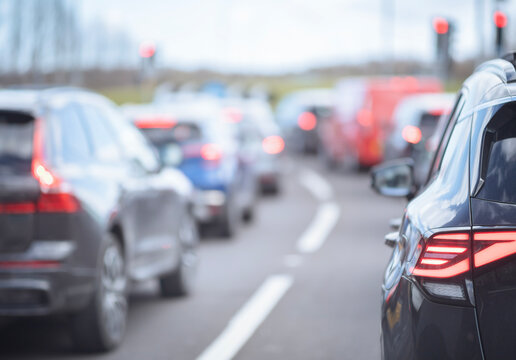 Traffic jam congestion with rows of cars on highway in rush hour