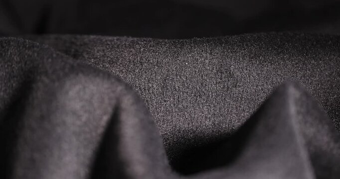 synthetic fabric for the manufacture of outerwear for the autumn and winter , black synthetic yarn fabric for the production of warm clothing, fabric texture