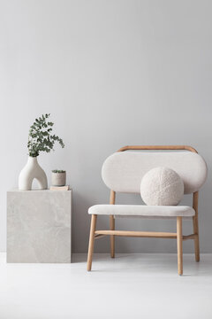 Modern scandinavian style interior with chair and trendy vase, Home staging and minimalism concept. Minimal Scandi interior. Empty white wall background.