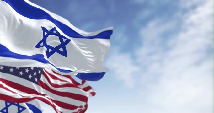Israel and United States flags waving together. Concept of alliance, diplomacy and international relations. Seamless 3d render animation. Slow motion loop. Selective focus