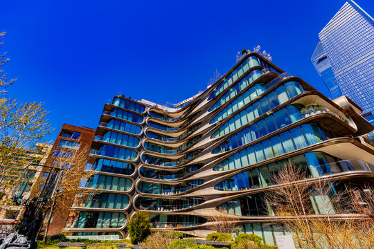 New York, United States - April 11, 2026: The futuristic 520 West 28th Street building, designed by Zaha Hadid, features a striking hand-rubbed steel facade with a signature chevron pattern.