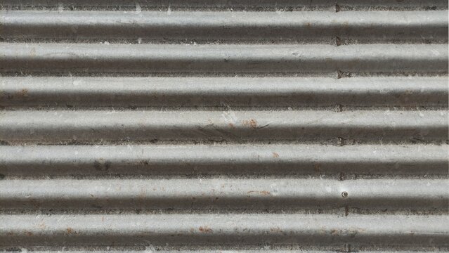 Close up of corrugated iron sheet metal creating a textured background for construction fence