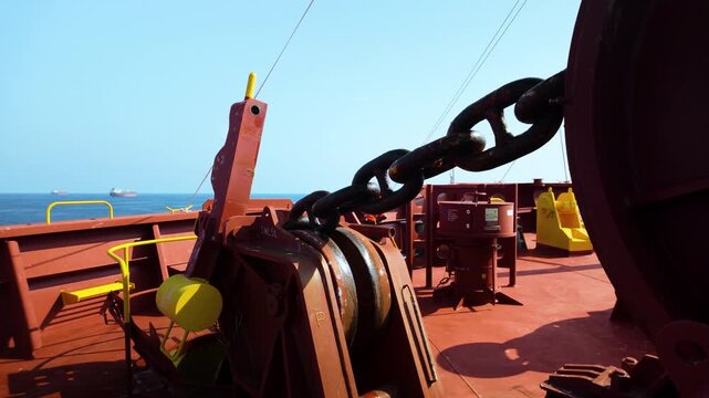Mooring equipment and anchor windlass on a tanker deck at sea.