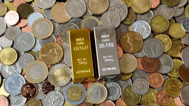 Gold and silver bullion or ingots as metals for bank storage, investments, and financial transactions. Gold and silver bars as a backdrop for your design