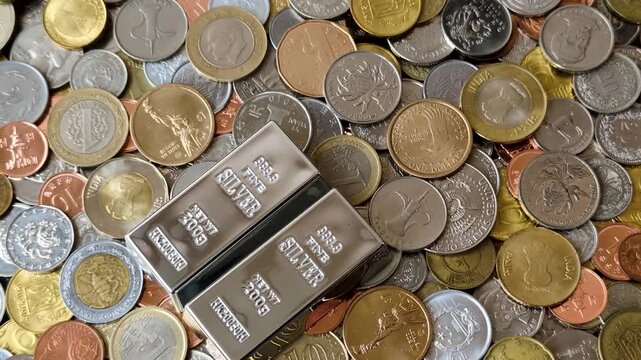 A silver bar, white metal against a backdrop of money, as a concept for the sales market. A silver bar as a background for your design
