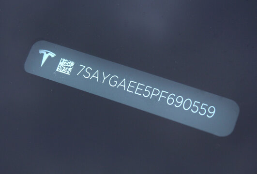 Vinnytsia, Ukraine; April 10, 2026. Close up Tesla Y VIN code. Vehicle identification number. Tesla Y number vehicle. Tesla Y car unique code. VIN number new electric car. Tesla Y Car VIN Number. Elec