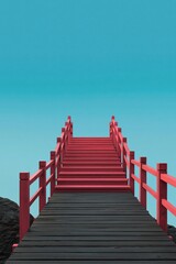Fototapeta premium Red pier staircase extending over dark decking into clear sky