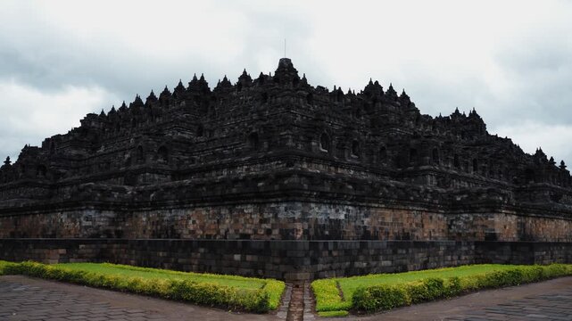 Cinematic footage of the iconic Borobudur Temple in Indonesia. Majestic stone stupas, ancient carvings, and serene atmosphere create a powerful spiritual and cultural scene.