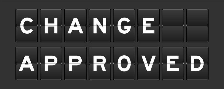 Black color analog flip board with word change approved on gray background