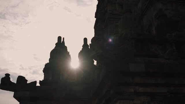 Cinematic footage of the historic Prambanan Temple in Indonesia. Majestic stone structures, intricate carvings, and ancient architecture create a powerful cultural and spiritual atmospher