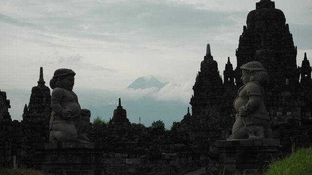 Cinematic footage of the historic Prambanan Temple in Indonesia. Majestic stone structures, intricate carvings, and ancient architecture create a powerful cultural and spiritual atmospher