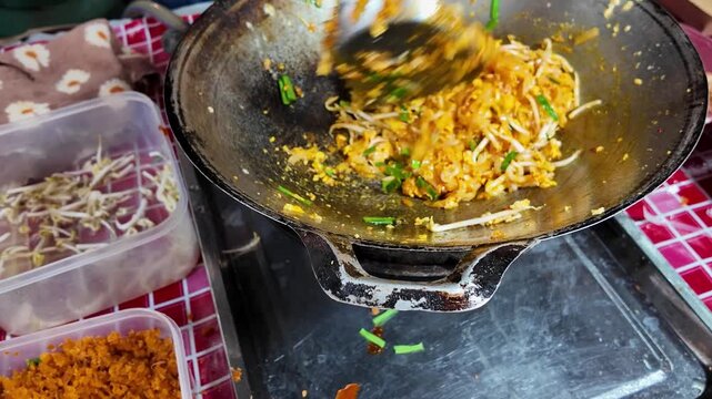 Tossing Pad Thai in Wok with Fresh Chives Street Food Action 4K