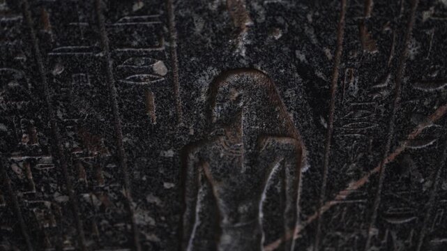Ancient egyptian pharaoh relief with hieroglyphic writing carved in stone, a close-up revealing historical symbols, cultural heritage, and pharaonic civilization art