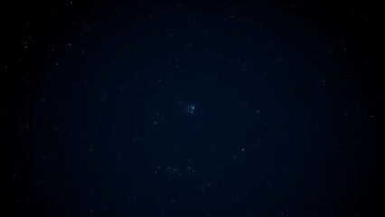 Fototapeta premium Wide shot of winter night sky with faint blue-white Pleiades star cluster.