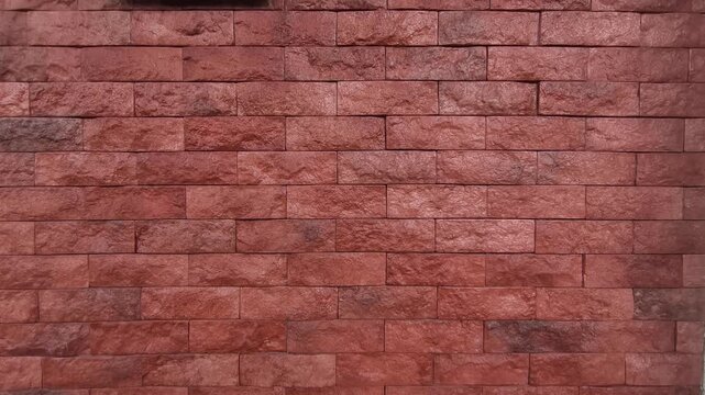 Modern artificial slate stone panels are professionally installed on an interior wall. This textured grey surface adds a sophisticated and rugged aesthetic to the room.